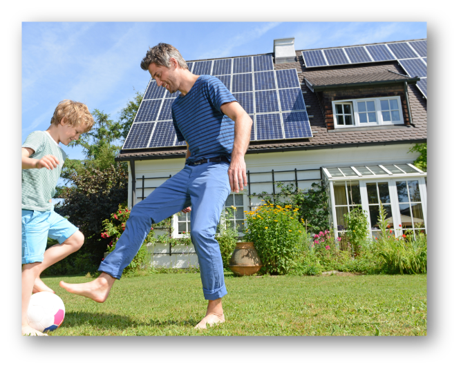 dad-playing-with-son-in-garden-house-solar-panels